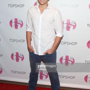 Actor Josiah Lipscomb attends a shopping charity event hosted by Courtney Sixx at TopShop on July