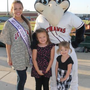 Miss California Southern National Teenager posing with KaBoom and kids