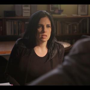 Janine Laino as Agent Scott deals with Assemblyman Dean Batta (Tom Sizemore) during a tense conversation