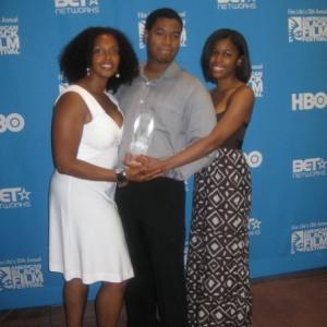 After winning the HBO Short Film Competition WriterDirector Kiel Adrian Scott shares a moment of celebration with fellow The Roe Effect Producers Kiara C Jones and Noelle K Barnes