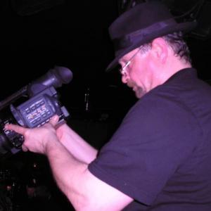 Bill Stoneking weilding the camera on the set of DJ International Television in Chicago.