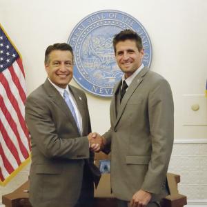 With Gov. Brian Sandoval at the signing of Nevada's film tax credit legislation.