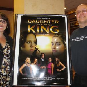 Angela Corso, program manager of the Chatham-Kent Women's Centre, and director Matthew Marshall pose by a poster of his film, Daughter of the King. The CKWC and Marshall presented a hometown screening with proceeds going to CKWC.