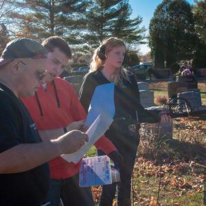 Matthew on set of Falling For You for the funeral scene as 1st AD helping the crew review requirements for the upcoming shot.