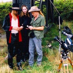 HT directs Pimp & Hooker scene for Vancouver Vagabond, 2002. Old and new school filmmaking: CP16mm with DV camera mounted with frames matched for replay and behind the scenes taping of scene.