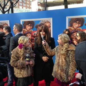 Hannah Loesch and her twin sister Cailin interviewing Catherine Keener at the NYC premiere of The Croods