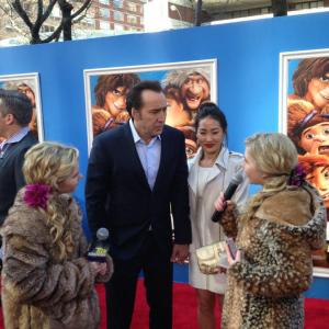Hannah Loesch and her twin sister Cailin interviewing Nicolas Cage at the NYC premiere of The Croods
