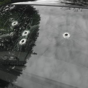 Blowing holes in a windshield with glue sticks using trunnion guns.