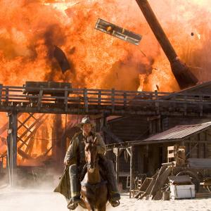 Josh Brolin riding out as town burns down in St Francisville LA on location for Jonah Hex 2009