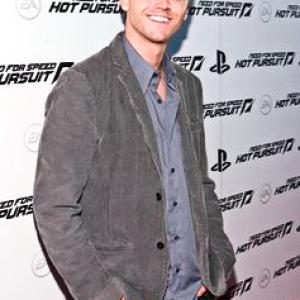 Nick Grosvenor poses on the red carpet at the Electronic Arts' 
