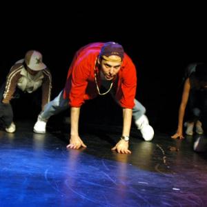 Vlad on stage performing a choreographed Hip Hop routine as part of Kaylene and Crew at Tour De Dance 5, Metro Theatre, Sydney