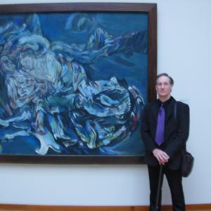 Ken Ludden poses at Kuntsmuseum Basel by Oscar Kokoshka painting 