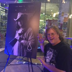 Brandyn Cross with Poster at the Alienate Premier
