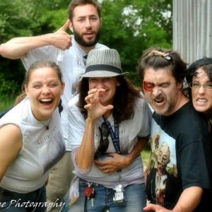 Some members of cast and crew together for a candid shot on the set of 'Kill Me Again'.