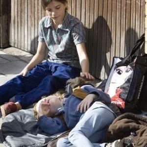 Tehilla takes care of her little brother in a break between cuts while filming Svinalngorna