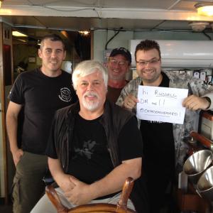 On the bridge of the Steve Irwin with Australian Director Jeff Hansen Captain Paul Watson Legend Peter Brown and myself holding a sign up to Russell Crowe to prove who we are