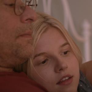 Ana MulvoyTen and Michael Nyqvist in The Girl in the Book 2015