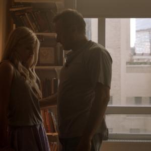 Still of Ana MulvoyTen and Michael Nyqvist in The Girl in the Book 2015