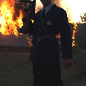 Wade Smith as a Pinkerton Guard on the burning set of Let It Be War in Athens Ohio