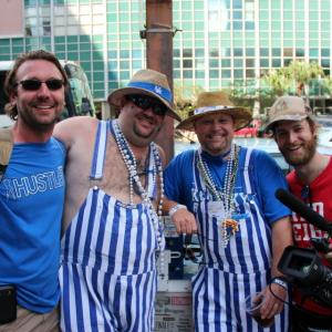 Producer Wade Smith  Director Rory Delaney pose with a couple of UK fans during a shoot for the film Red v Blue at the Final Four in New Orleans La