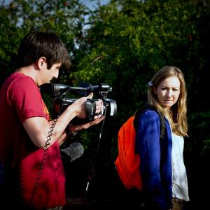 Director Addison Sandoval composing a shot with Actress Carly Van Skaik.