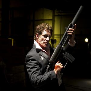 Actor John Shea poses with the hero weapon used in the film 51 This weapon entitled The POW pulse operating weapon was built in 3 days and modeled after a airblast rifle in 1960s FYI John loved posing with this weapon