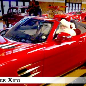 Peter Xifo  As the Mercedes Benz Santa getting ready for another take driving a 250K Mercedes Roaster Pete has been Mercedes Exclusive TV Santa in the US for their holiday commercials since 2010
