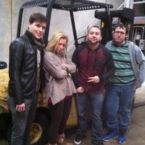 Devin M, Thomas Rivas and cast on the abandoned warehouse set of 