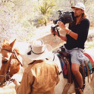 Lukas Colombo Directing from a Horse on the set of 