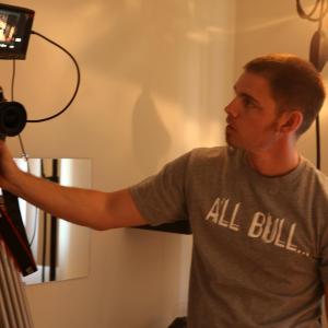 Checking the shot while directing the short film Blm