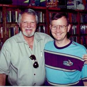 Gregory Schmauss with Author Clive Cussler at a book signing.