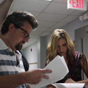 Ted Souppa goes over lines with Emily Cutting on the set of Hide