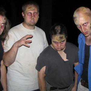 On set of Blaming George Romero In Photo From Left to Right in zombie attire Jared Visco Blake Zawadzki Casey Okamoto and Aaron Visco