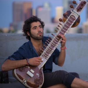 Giovanni V Giusti performing Sitar on the rooftop of the Wilshire Westlake Building Los Angeles CA