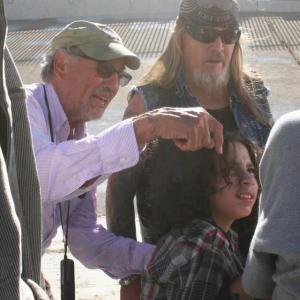 Cinematographer Vilmos Zsigmond go over a scene with cast