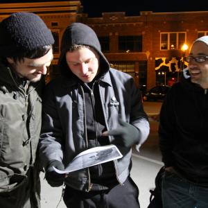 Actor Joe Belknap and cowritersdirectors John Pata and Adam Bartlett look over story boards while filming Dead Weight