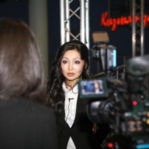 Marina Kunarova gives interview on her films premiere of Hunting the Phantom in Kazakhstan