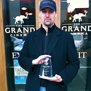 Aron Michael Thompson with the award for Best Regional Film awarded to SHUFFLE at the 2010 Tacoma Film Festival