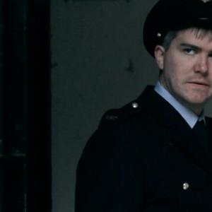 Director John Maltby, playing his cameo role as The Guard in Gallows