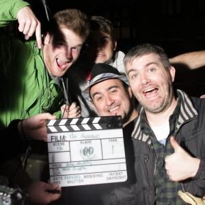 Cast and crew celebrate reaching slate 100 on day 4 of The Possessors shoot