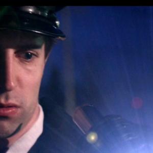 Michael Kram portraying an Italian police officer in the 