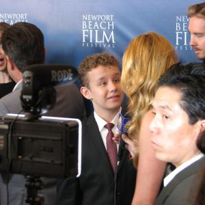 Carsen Warner on the Red Carpet at the Newport Beach Film Festival for the festival opening film LOVESICK