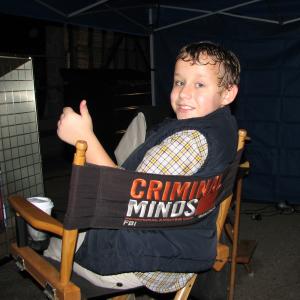 Carsen Warner on the set of Criminal Minds Warming up a bit while working in the rain