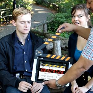 Michael Wetherbee and Emily Dennis ready to shoot their scene and director Joseph Villapaz works the slate.