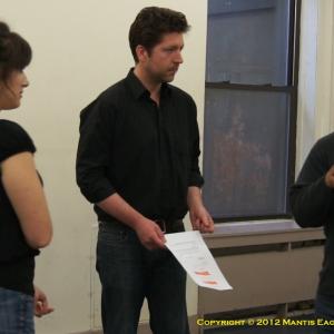 Director Joseph Villapaz provides feedback to Rebekah Tadros and Randolph Hubard during rehearsals