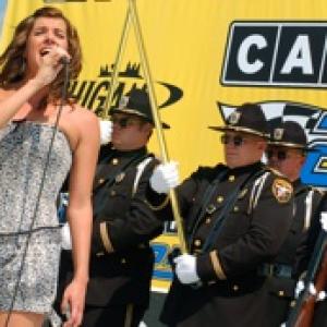 Amy Rivard sings the Anthems at NASCAR's Carfax 250 at the Michigan International Speedway.