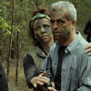 Former psychiatrist Lina talks the Mayor down during a confrontation with an unpredictably violent Diedre in the ZOMBIE indie horror One Last Sunset Redux
