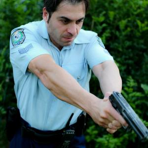 Still of Bobey Taleb in Horizons Crossing playing the role of a Police OfficerConstable Nick Francis