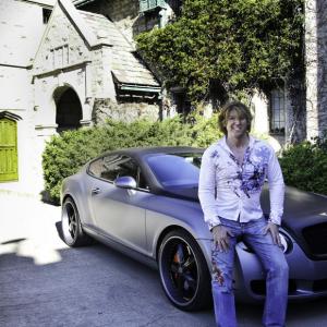 Michael Blakey at the Playboy Mansion with his new toy.