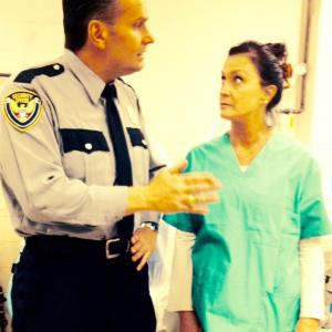 As no nonsense ER guard in TV Show Odd Mom Out  off set pic